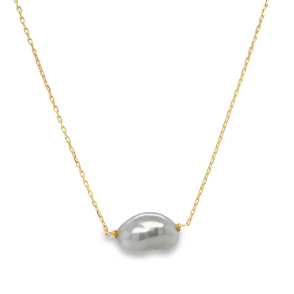This Tahitian Single Keshi Pearl Necklace is the perfect accessory for any occasion. Crafted with 18k yellow gold, this necklace radiates sophistication and style. Show the world that you don't just own jewelry - you make a statement. Keshi pearls are known for their unique shape and origin.