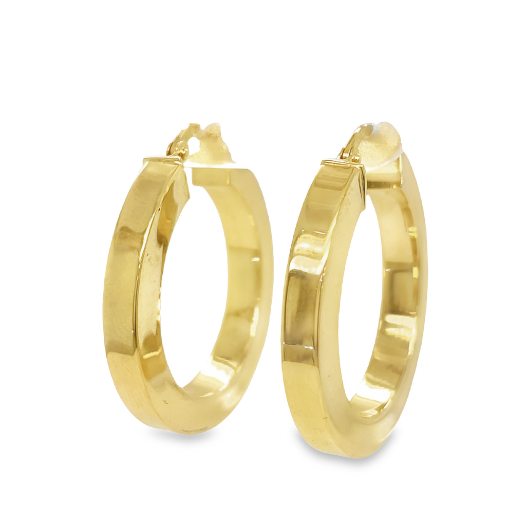 These classic yellow gold hoops have been tailored for a perfect medium size, measuring 1 1/4 inches in diameter and 5.00 mm in thickness. Crafted from thick, high-quality gold, these earrings are easy to wear and will offer a timeless look.