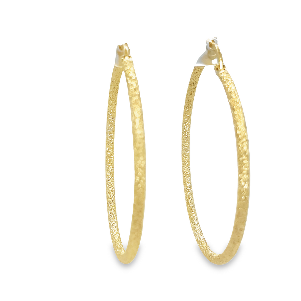 These Italian Gold Matte Finish Hoops Earrings offer beautiful craftsmanship in a classic style. Create effortless, timeless looks with the 2.00 mm thickness, 1.5" diameter, and hand-finished matte finish. Stand out from the crowd wearing these elegant earrings.