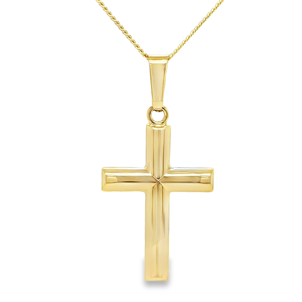 Crafted with expertise in Italy, this 14kt yellow gold cross showcases timeless elegance. The 14 karat yellow gold shines radiantly, while the optional ($599) 14 karat yellow gold chain 1.5" long complements the intricate design. At one inch long, this cross is the perfect addition to any jewelry collection.