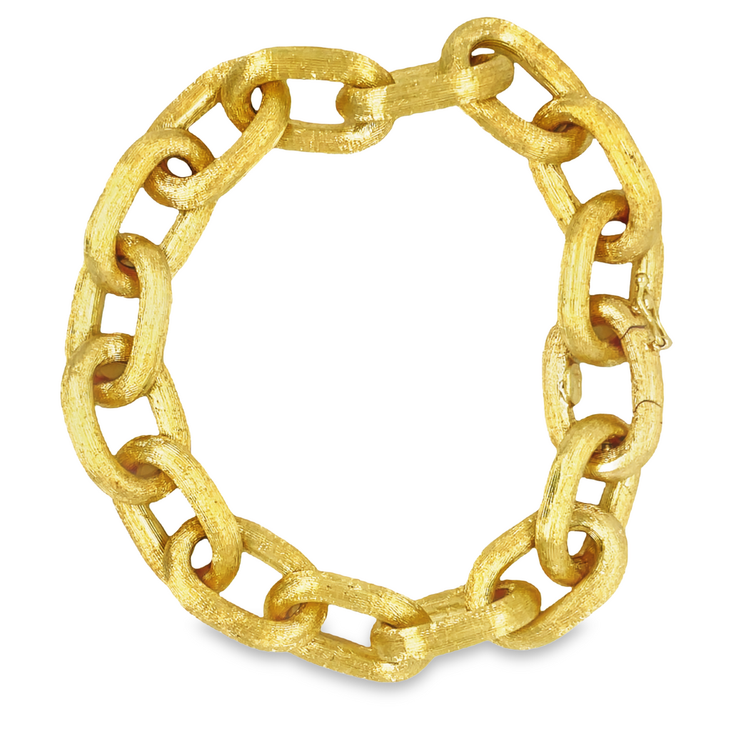 Discover modern elegance with this 18K Italian-made bracelet. The thick open links boast a stylish etched texture and a secure hidden clasp, making it the perfect accessory for the fashion-forward individual.
