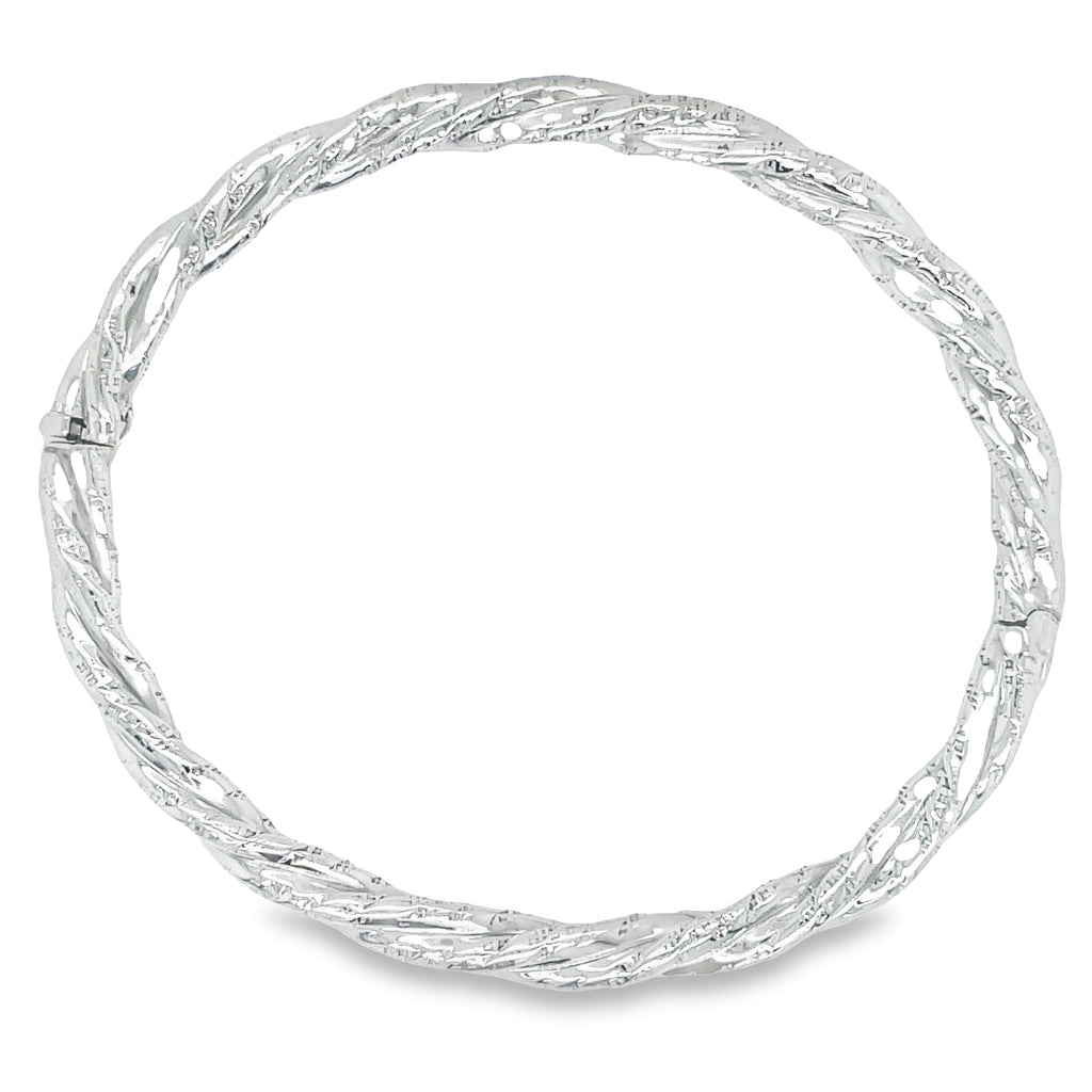 Make a statement with this white gold twisted bangle, crafted to be both comfortable and chunky. This stylish bracelet is perfect for everyday wear.  Estate Section.