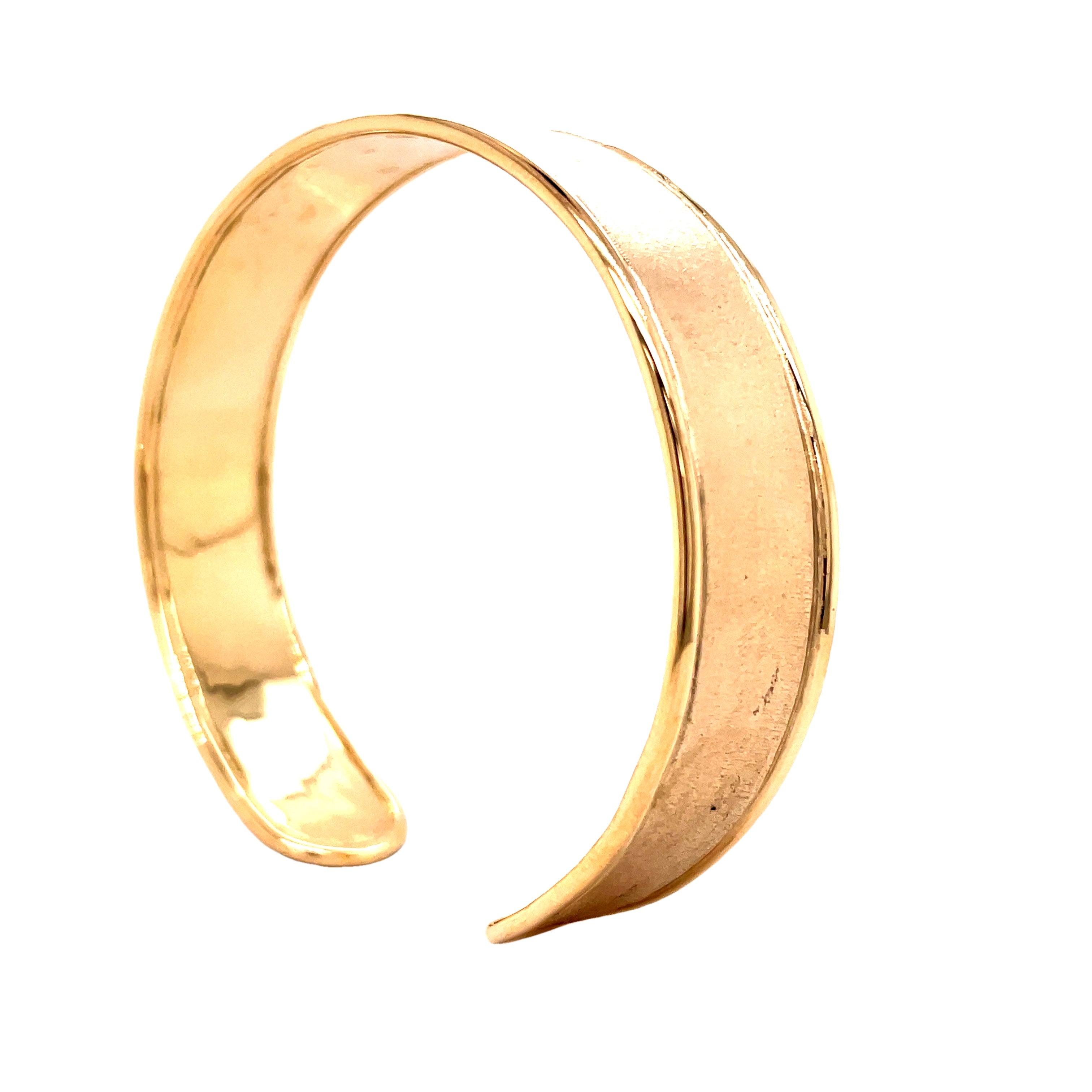 Indulge in the sophistication of this exquisite handmade, 14k yellow gold cuff bangle. Its lustrous matte finish adds a touch of elegance to this cuff bracelet, weighing 17.4 dwt. Experience luxury and craftsmanship at its finest with this exclusive piece.