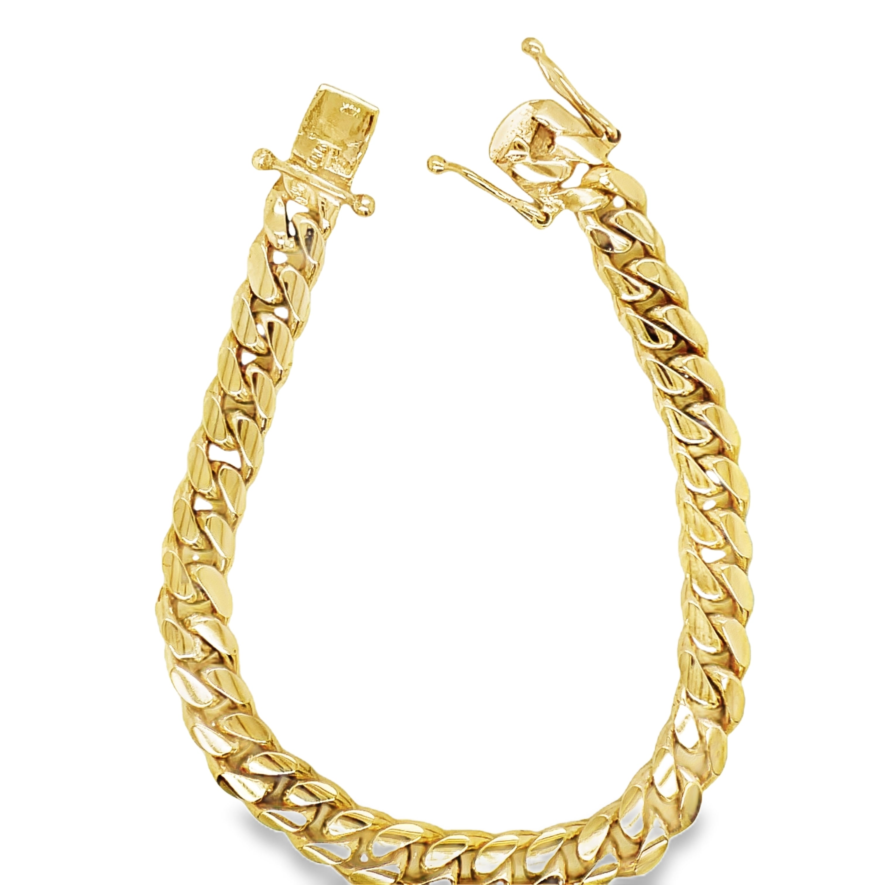 Indulge in luxury with our 14K Cuban Curb Link Yellow Gold Bracelet. Crafted in 14k yellow gold, this bracelet features a sophisticated curb link design and is secured with a box clasp and figure eight closure. With a weight of 21.50 dwt, this bracelet is not only stunning but also substantial. Elevate any outfit with this exclusive and tasteful piece