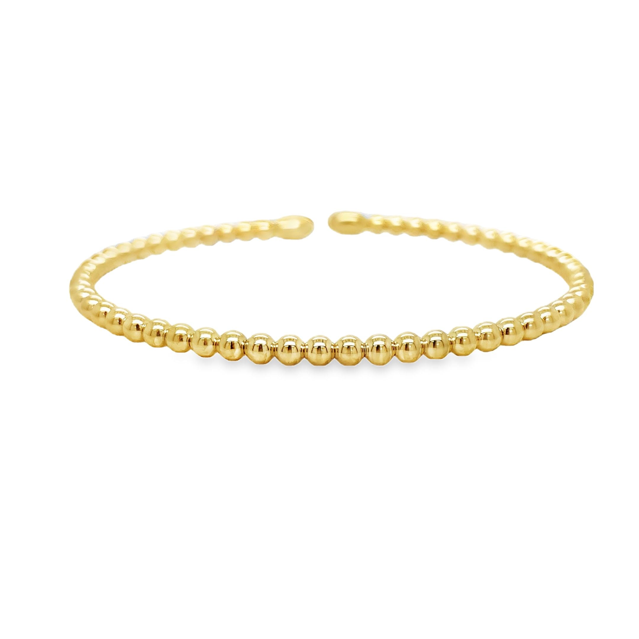 Indulge in pure elegance with our 18k Italian Yellow Gold Bead Bangle Bracelet. Handcrafted in Italy, this exquisite piece showcases the finest quality of 18k yellow gold, featuring a stunning bead style design. Part of our exclusive bangle collection, this bracelet effortlessly combines white and yellow gold for a truly sophisticated and luxurious look. Elevate your jewelry collection with this timeless treasure.