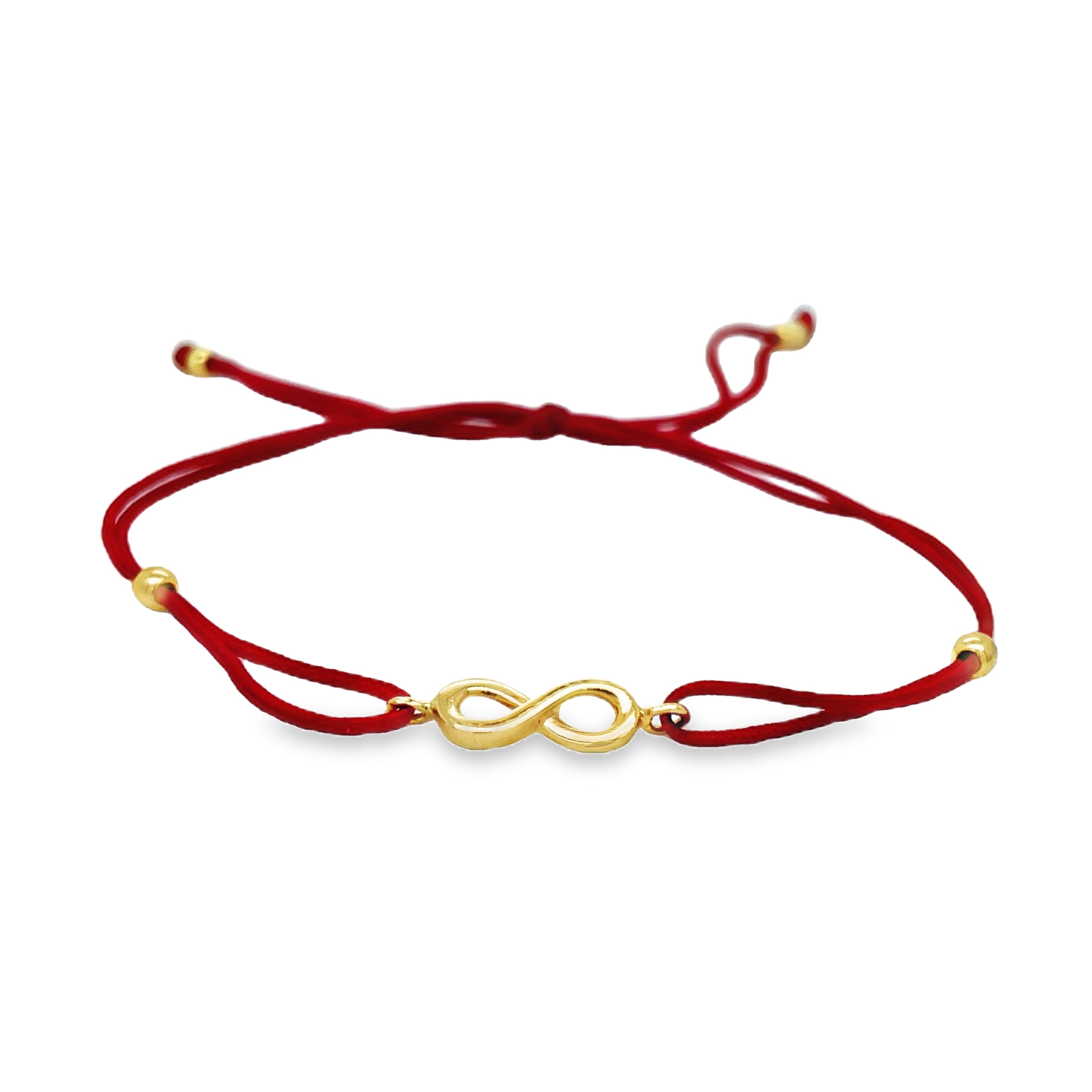 Add a touch of elegance to your look with our Dainty Yellow Gold Infinity Cord Bracelet. Crafted from 14k yellow gold and adorned with the symbolic infinity sign, this bracelet represents endless love and boundless possibilities. The adjustable red cord allows for a perfect fit, making it a versatile and stylish accessory for any occasion.