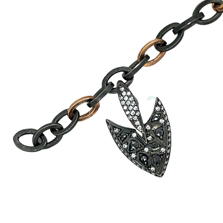 Show off sophisticated style with this mens bracelet. Crafted from 18K rose gold and oxidized sterling silver, this bracelet is complete with a diamond spear clasp for a touch of sparkle. Perfect for everyday wear, this bracelet elevates any look.