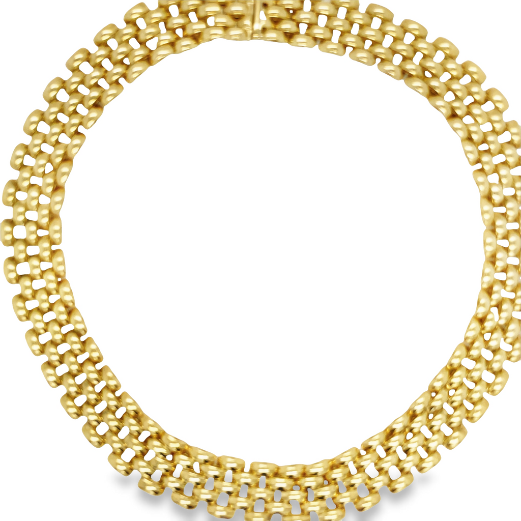This Panther Link 5 Row Italian Made Necklace is crafted with the highest quality yellow gold and measures 15 mm wide. It has a hidden clasp for added security and durability, making it a perfect long-term accessory. Enjoy the combination of Italian craftsmanship and timeless style.