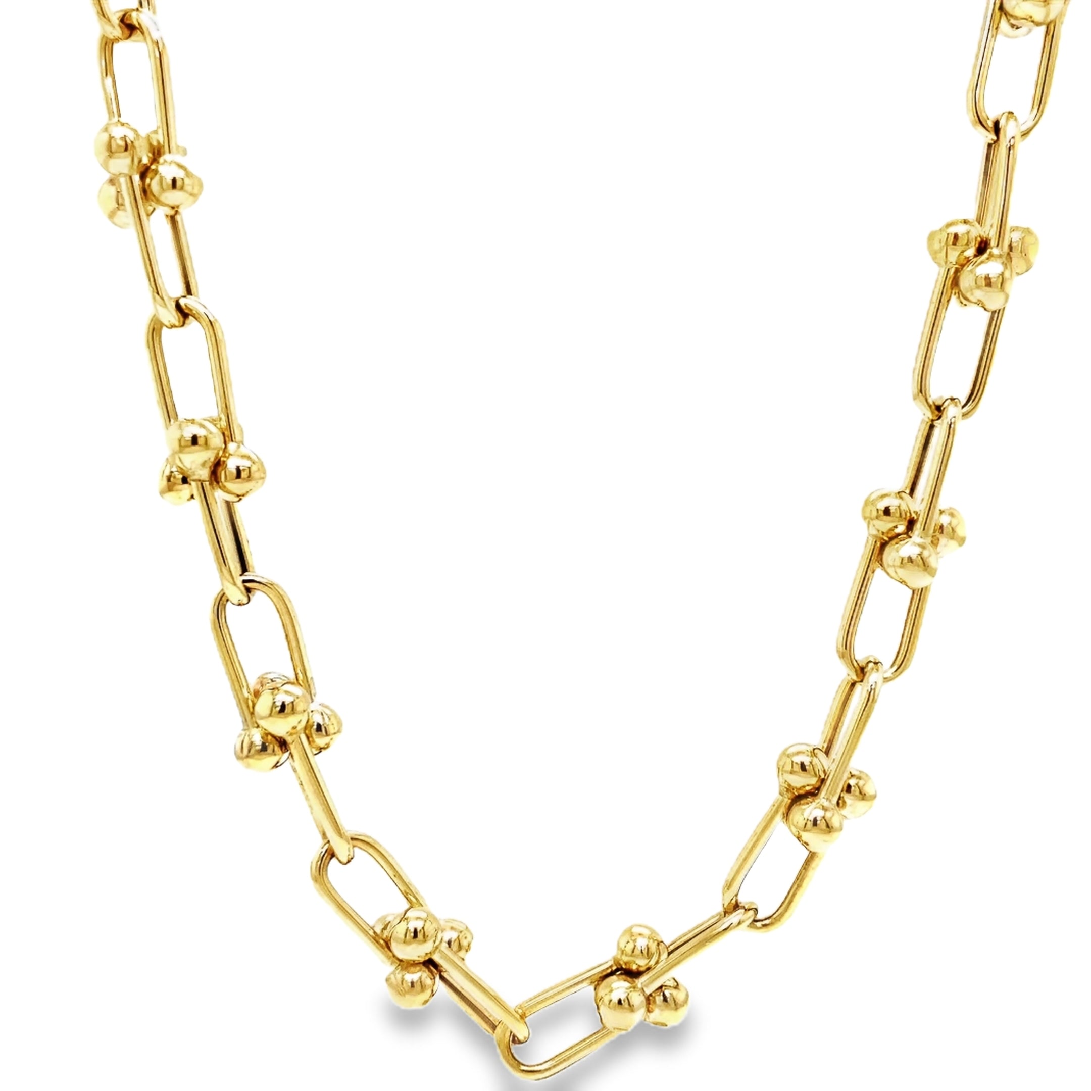 ndulge in timeless elegance with our 14K Italian Made Gold Hardware Chain Link Necklace. Crafted from luxurious 14k yellow gold, this Italian-made necklace features a secure lobster catch and a sturdy hardware link design. At 18" in length and 7.50 mm in thickness, it is the perfect statement piece for any occasion.