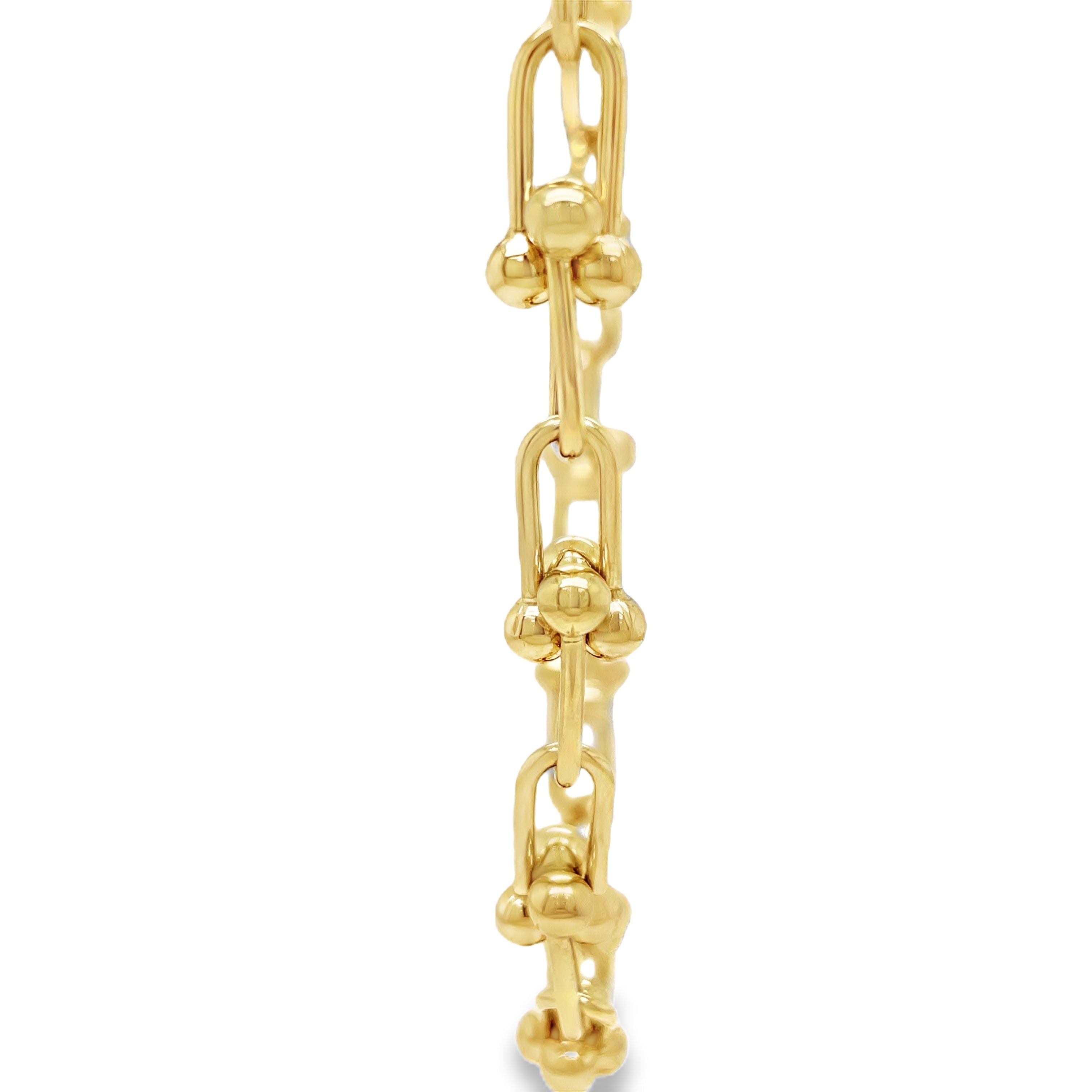 ndulge in timeless elegance with our 14K Italian Made Gold Hardware Chain Link Necklace. Crafted from luxurious 14k yellow gold, this Italian-made necklace features a secure lobster catch and a sturdy hardware link design. At 18" in length and 7.50 mm in thickness, it is the perfect statement piece for any occasion.