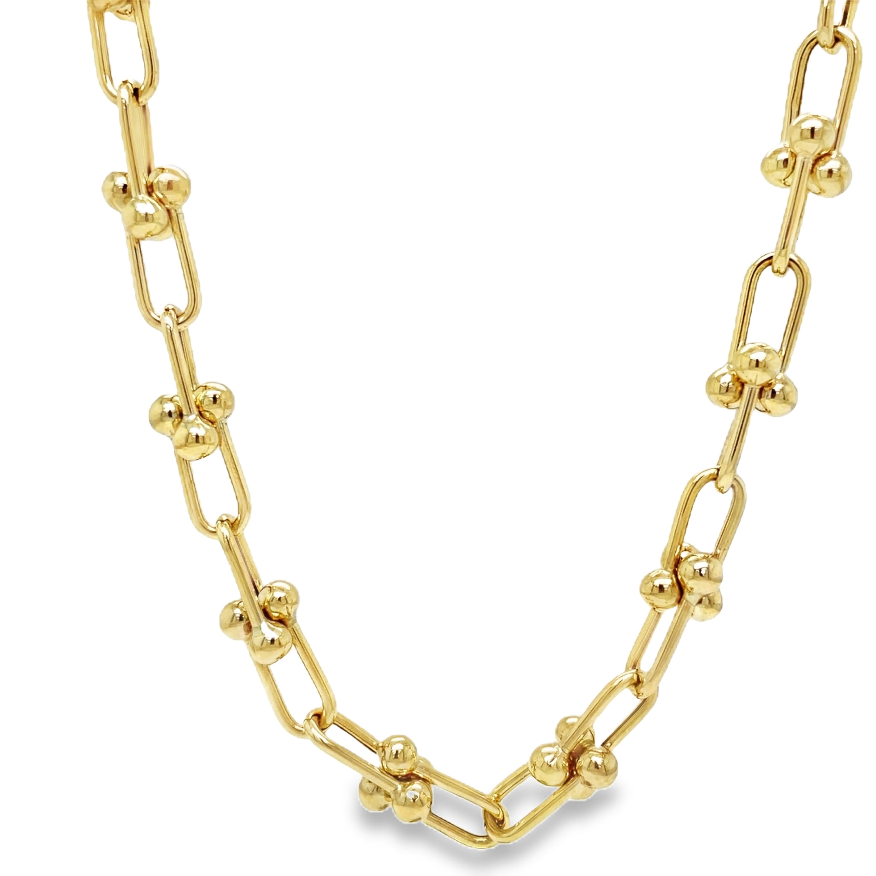 ndulge in timeless elegance with our 14K Italian Made Gold Hardware Chain Link Necklace. Crafted from luxurious 14k yellow gold, this Italian-made necklace features a secure lobster catch and a sturdy hardware link design. At 18" in length and 7.50 mm in thickness, it is the perfect statement piece for any occasion.