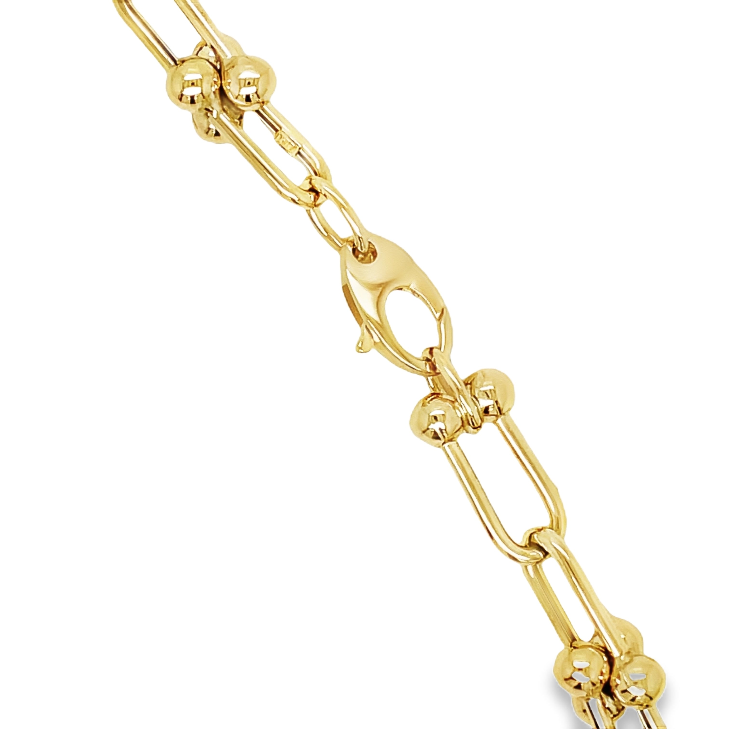 ndulge in timeless elegance with our 14K Italian Made Gold Hardware Chain Link Necklace. Crafted from luxurious 14k yellow gold, this Italian-made necklace features a secure lobster catch and a sturdy hardware link design. At 18" in length and 7.50 mm in thickness, it is the perfect statement piece for any occasion.