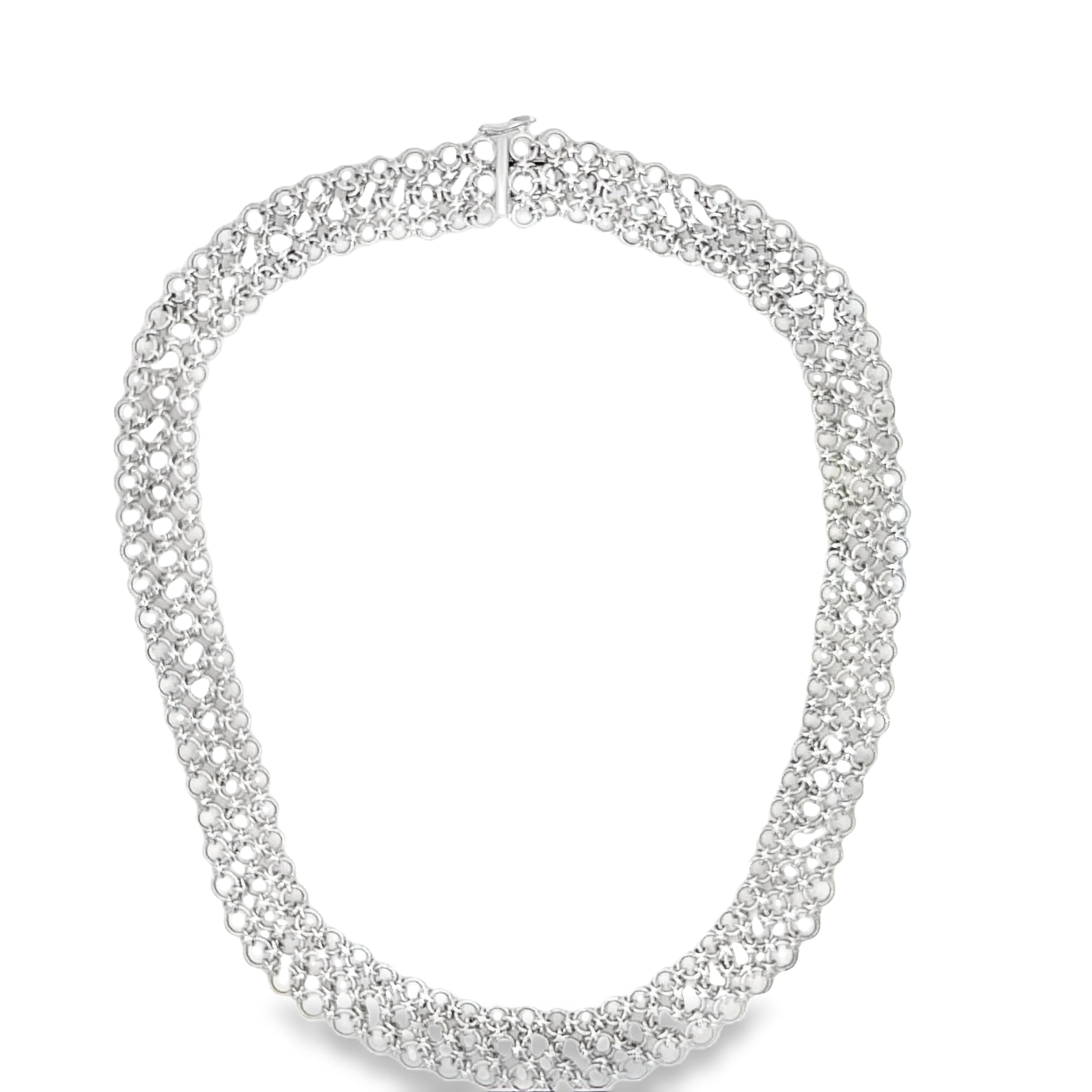 Adorn your neck with our exquisite Italian Made Platinum Choker Necklace. Crafted with premium platinum, this luxurious piece features a secure hidden clasp and a unique three row circle design. Its matte finish and woven style add a touch of sophisticated elegance. Elevate your style with this exclusive necklace.