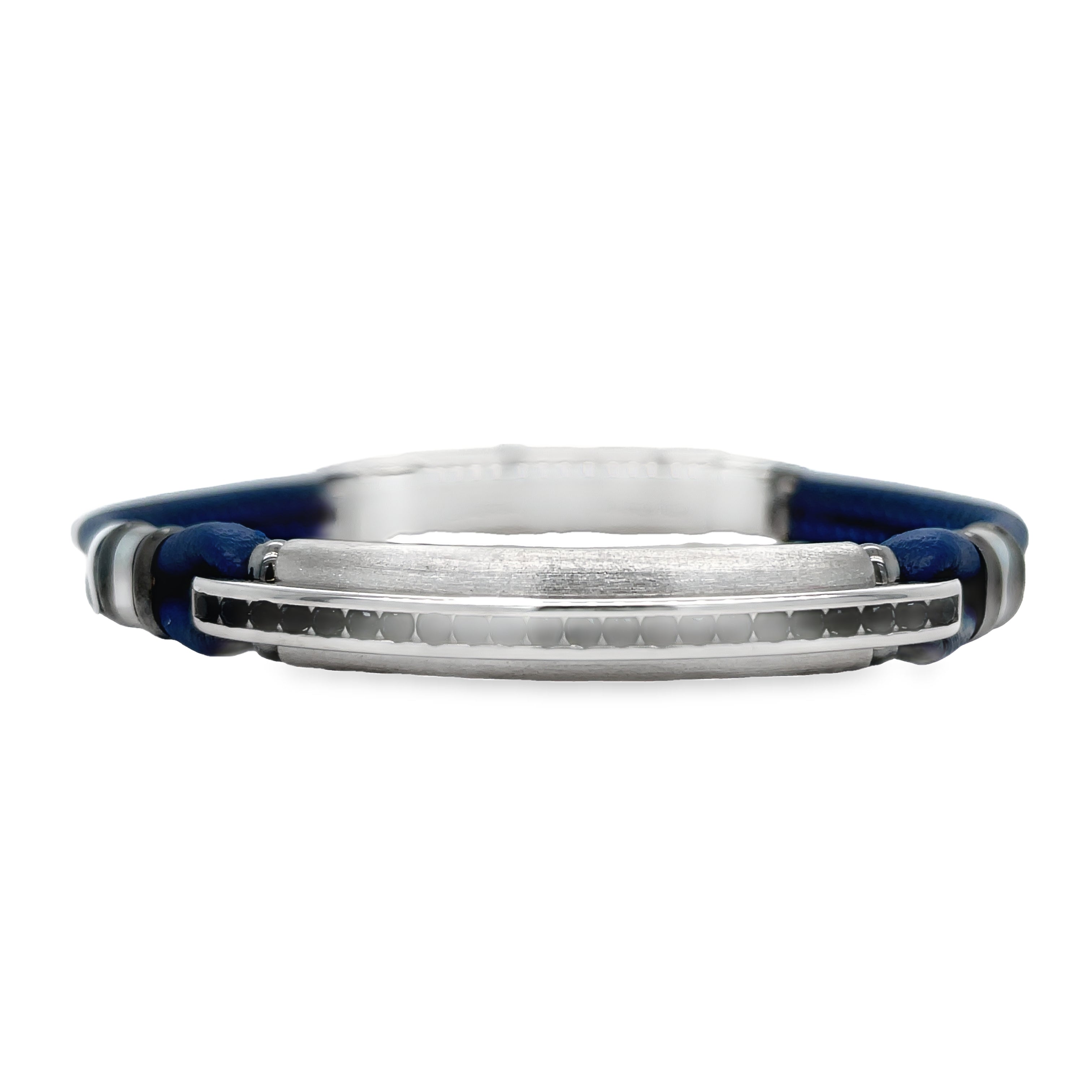 This Italian made Zancan bracelet features a blue leather band adorned with sparkling round spinel gems. Made of sterling silver, it offers an adjustable clasp for a perfect fit. Add a touch of elegance and sophistication to any outfit with this stunning piece.