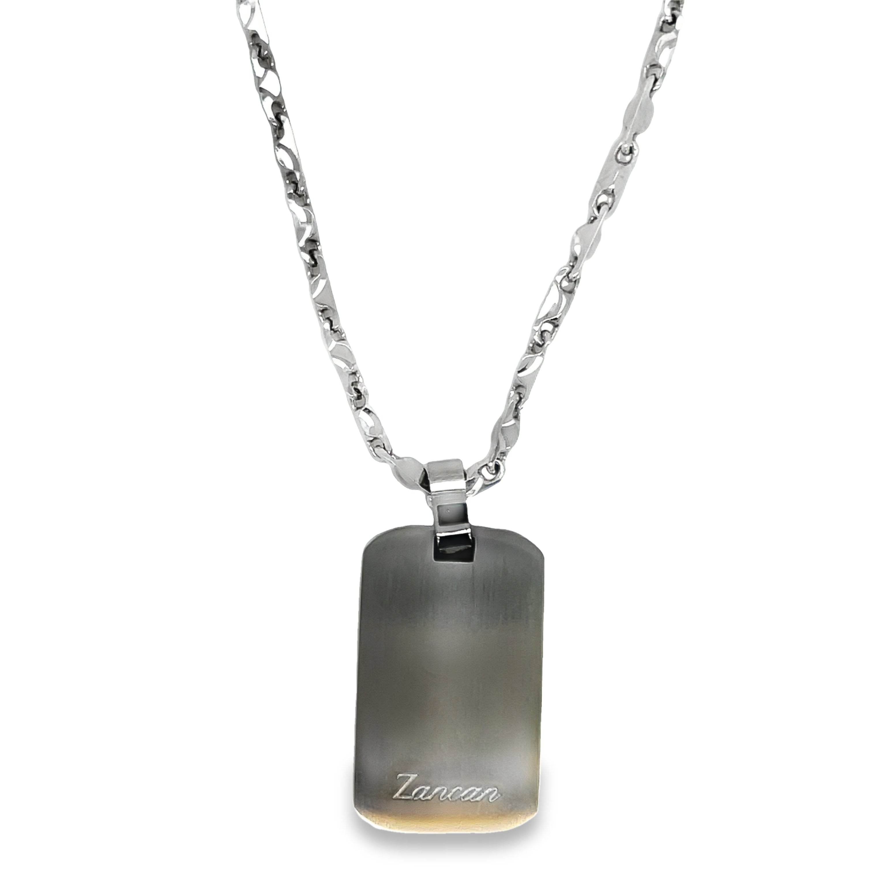 Expertly crafted in Italy, the Zancan Dog Tag is a stylish 30.00 mm pendant featuring a sleek black ceramic compass rose. Its rhodium coating adds a touch of sophistication and durability. Perfect for any dog lover or fashion-forward individual.