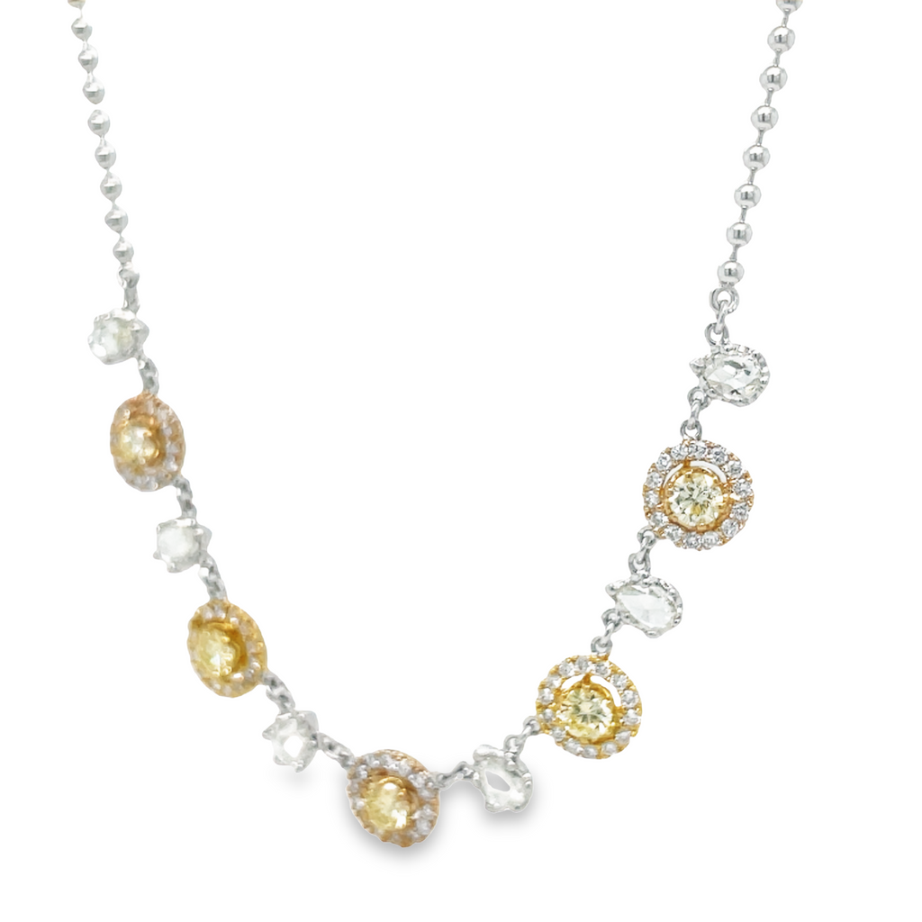 This Fancy Yellow Diamond Five Station Necklace is the perfect statement piece for any outfit. Crafted from 1.50 cts of fancy yellow diamonds, set in 18k yellow & white gold, this necklace is accented with rose cut pear shape diamonds and a bead chain. Add a touch of luxury to your wardrobe with this unique and stunning piece.