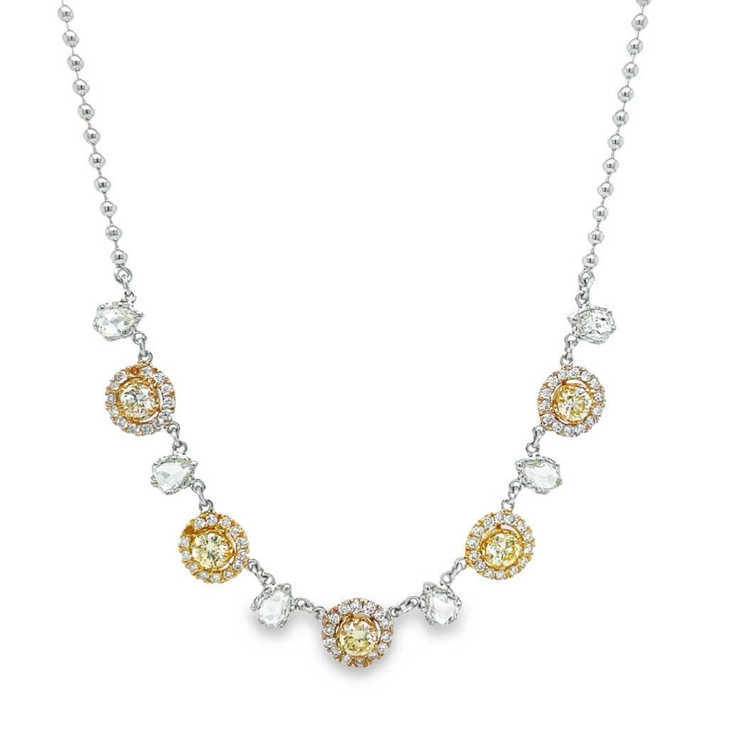 This Fancy Yellow Diamond Five Station Necklace is the perfect statement piece for any outfit. Crafted from 1.50 cts of fancy yellow diamonds, set in 18k yellow & white gold, this necklace is accented with rose cut pear shape diamonds and a bead chain. Add a touch of luxury to your wardrobe with this unique and stunning piece.