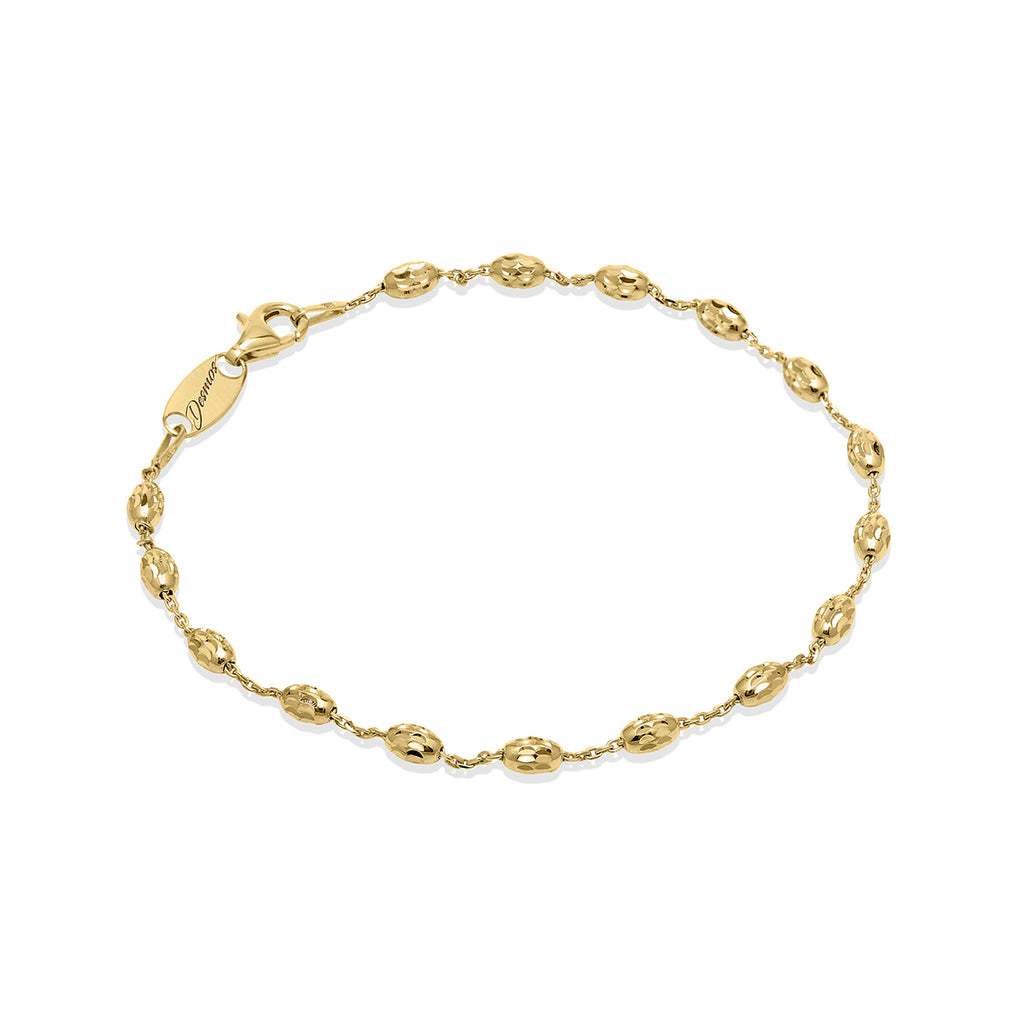 This 14K yellow gold bead bracelet adds a hint of sparkle to your style. Featuring diamond cut beads, it measures 7.5" long with an extension for a comfortable fit. A perfect piece for special occasions or everyday glam.