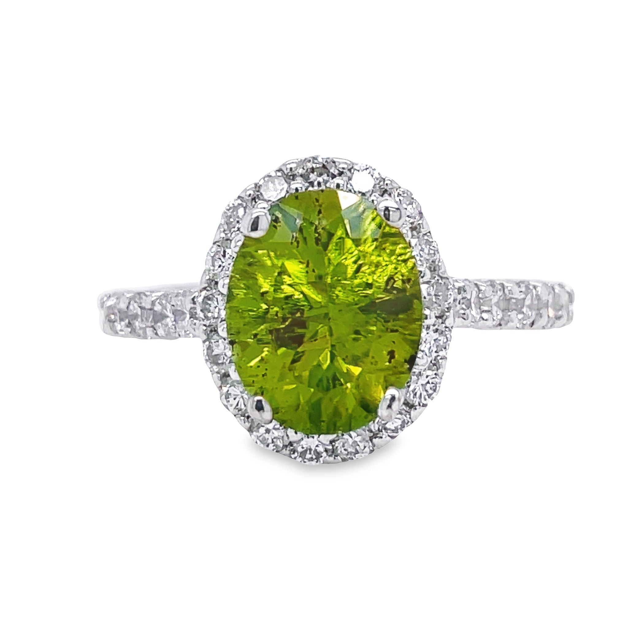 This exquisite Oval Peridot & Diamond Ring is crafted with a brilliant oval peridot paired with dazzling round diamonds that total 1.01 carats. Set in 14k white gold, lovely and precious, this beauty is sure to give you a timeless sparkle. Get ready to feel the love with this stunning ring!