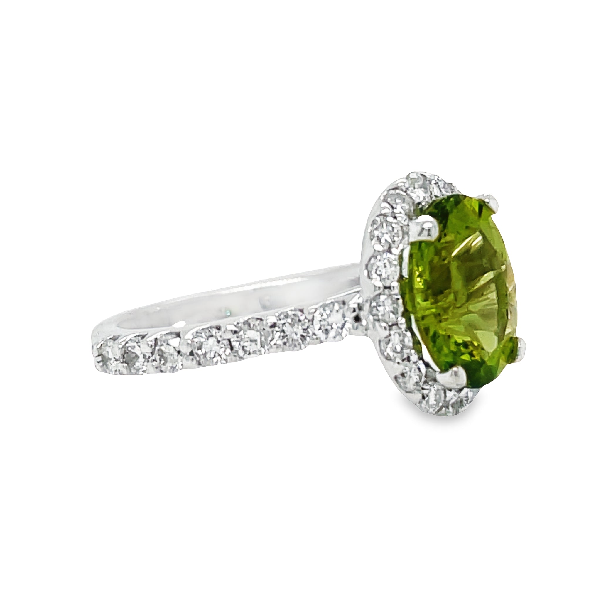 This exquisite Oval Peridot & Diamond Ring is crafted with a brilliant oval peridot paired with dazzling round diamonds that total 1.01 carats. Set in 14k white gold, lovely and precious, this beauty is sure to give you a timeless sparkle. Get ready to feel the love with this stunning ring!
