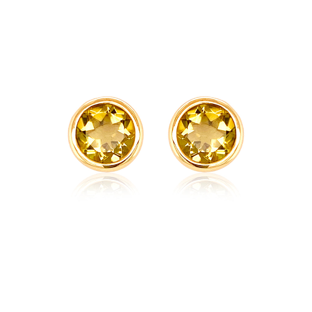 Beautifully crafted in 18k yellow gold, these citrine stud earrings will add a luxurious sparkle to any outfit. The large round citrines are secured with friction backs, ensuring a secure fit that will make you feel confident. Make a bold and sophisticated statement with these stunning earrings!