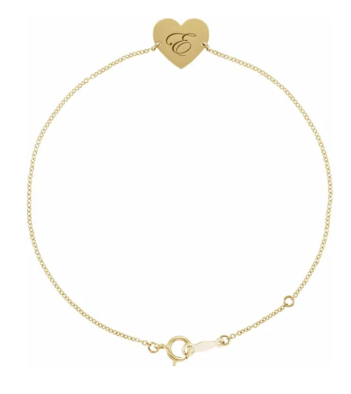 This personalized heart bracelet is expertly crafted with a 14k yellow gold heart pendant and sizeable loops for the perfect fit. Add a personal touch with custom engraving, making it a truly unique and sentimental gift. Express your love with this elegant and timeless piece.