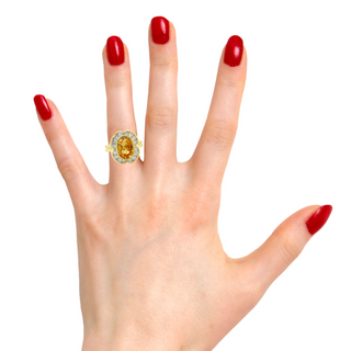 Try on view of 14k Yellow Gold Orange Yellow Sapphire & Diamond Ring