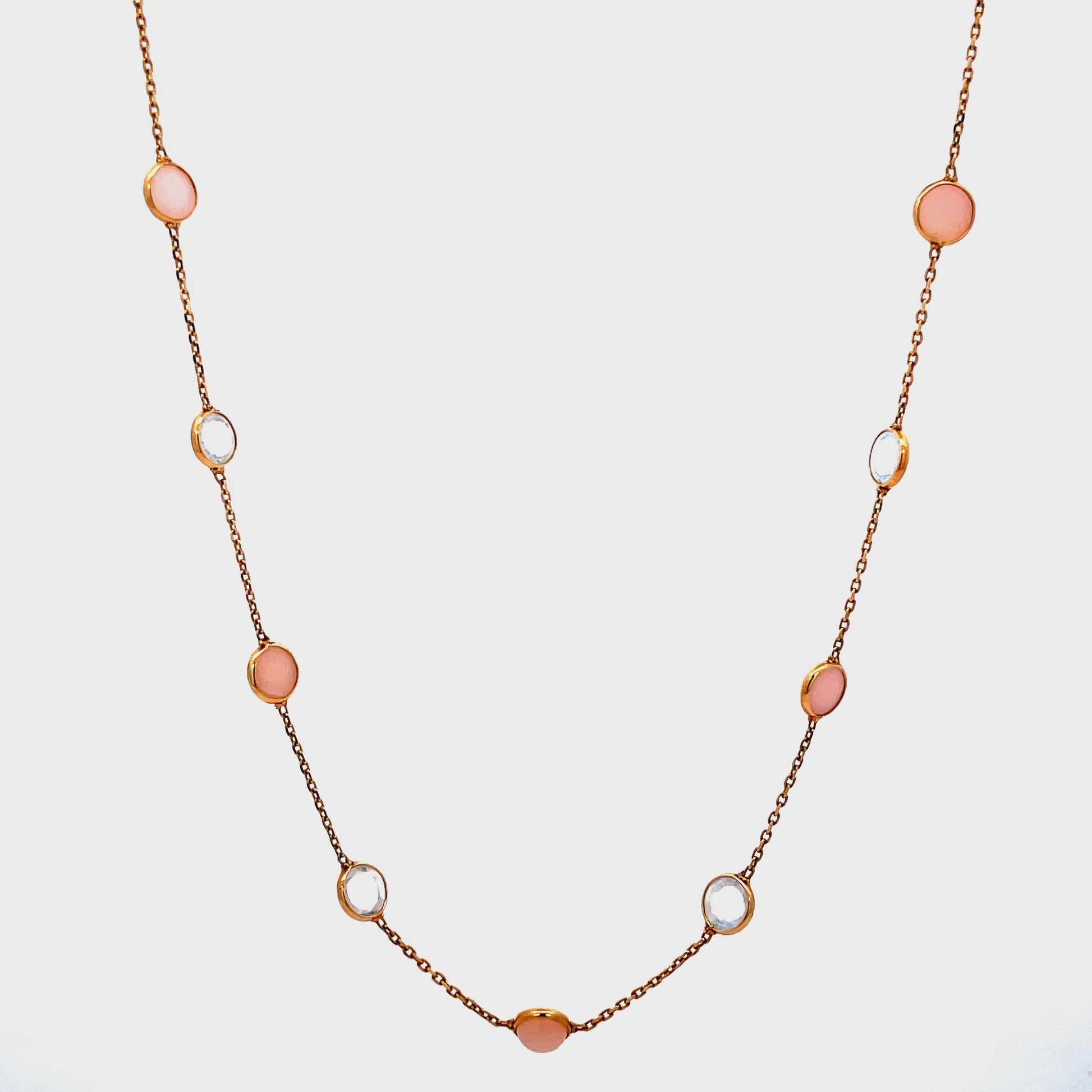 Try on view of 18k Peruvian Opal and Moonstone Cabochon Bezel Set Station Necklace in Yellow Gold