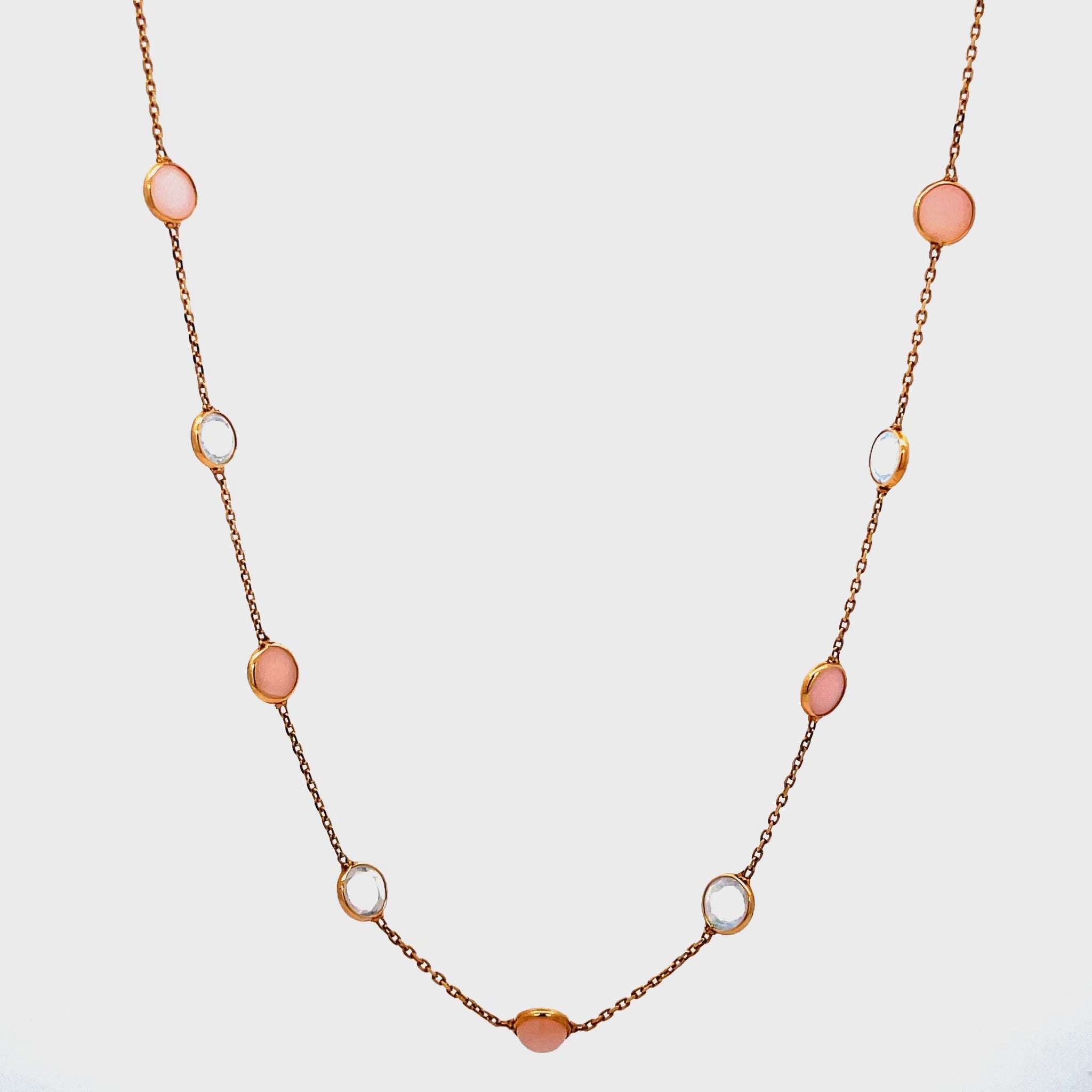 Try on view of 18k Peruvian Opal and Moonstone Cabochon Bezel Set Station Necklace in Yellow Gold