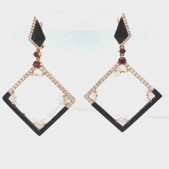 Look radiant wearing our stunning Unique Ice Jade, Diamond, Onyx & Garnet Drop Earrings! Luxurious 18k rose gold frames these rare ice jade stones, perfectly set with 0.79 cts of round diamonds, 6.21 cts of handmade onyx stripes, and four cabochon garnets. Get ready to shine!