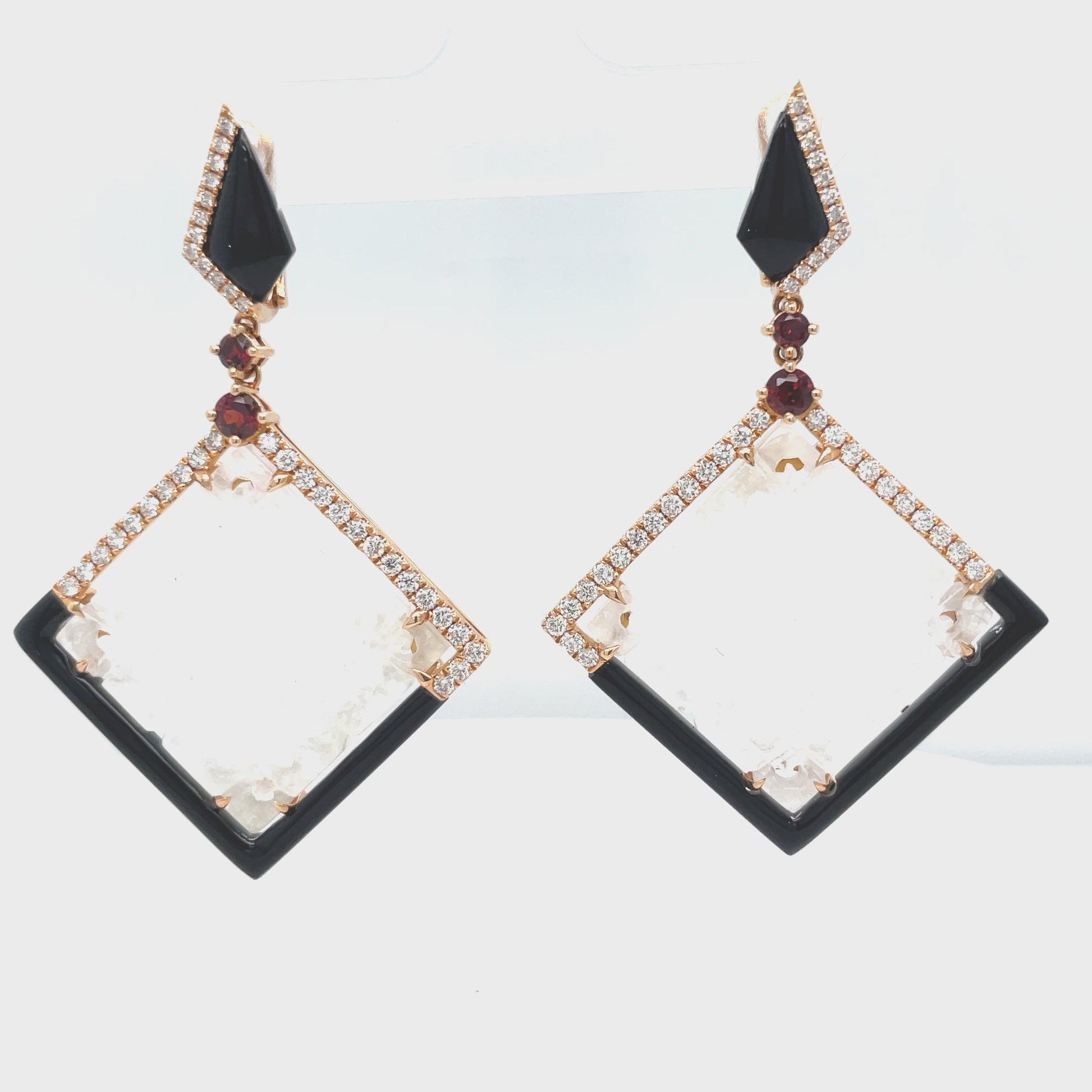 Look radiant wearing our stunning Unique Ice Jade, Diamond, Onyx & Garnet Drop Earrings! Luxurious 18k rose gold frames these rare ice jade stones, perfectly set with 0.79 cts of round diamonds, 6.21 cts of handmade onyx stripes, and four cabochon garnets. Get ready to shine!