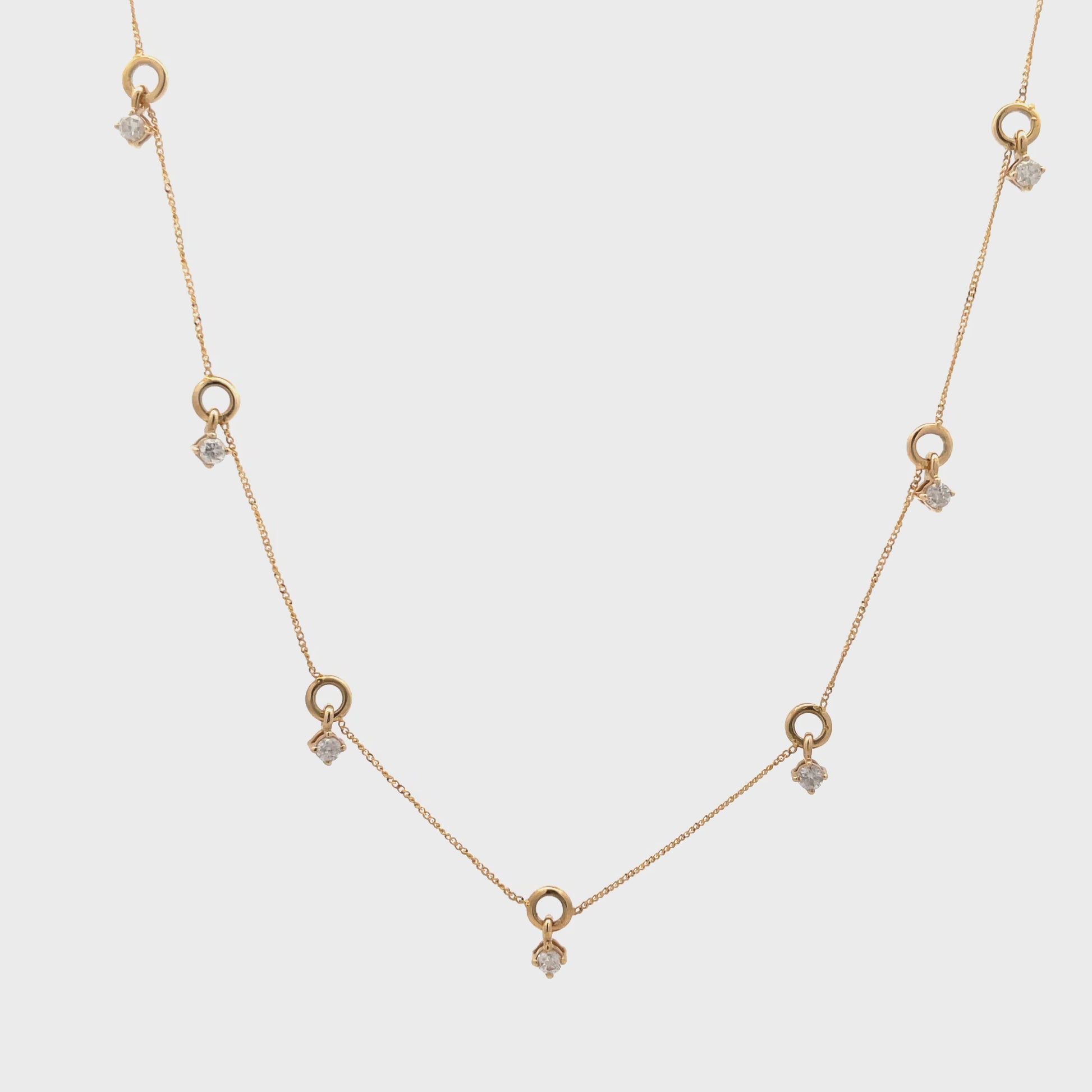 Watch Video of Seven Diamond Station Yellow Gold Dangling Necklace 0.30 cts
