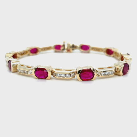 Experience the elegance and glamour of our Fine Diamond & Ruby Oval Shape Bracelet. Crafted from 14k yellow gold, this one-of-a-kind bracelet features smooth movement, a hidden clasp, and a stunning combination of oval shape rubies (7.45 cts) and round diamonds (2.00 cts). Impress with 7 inches of pure luxury