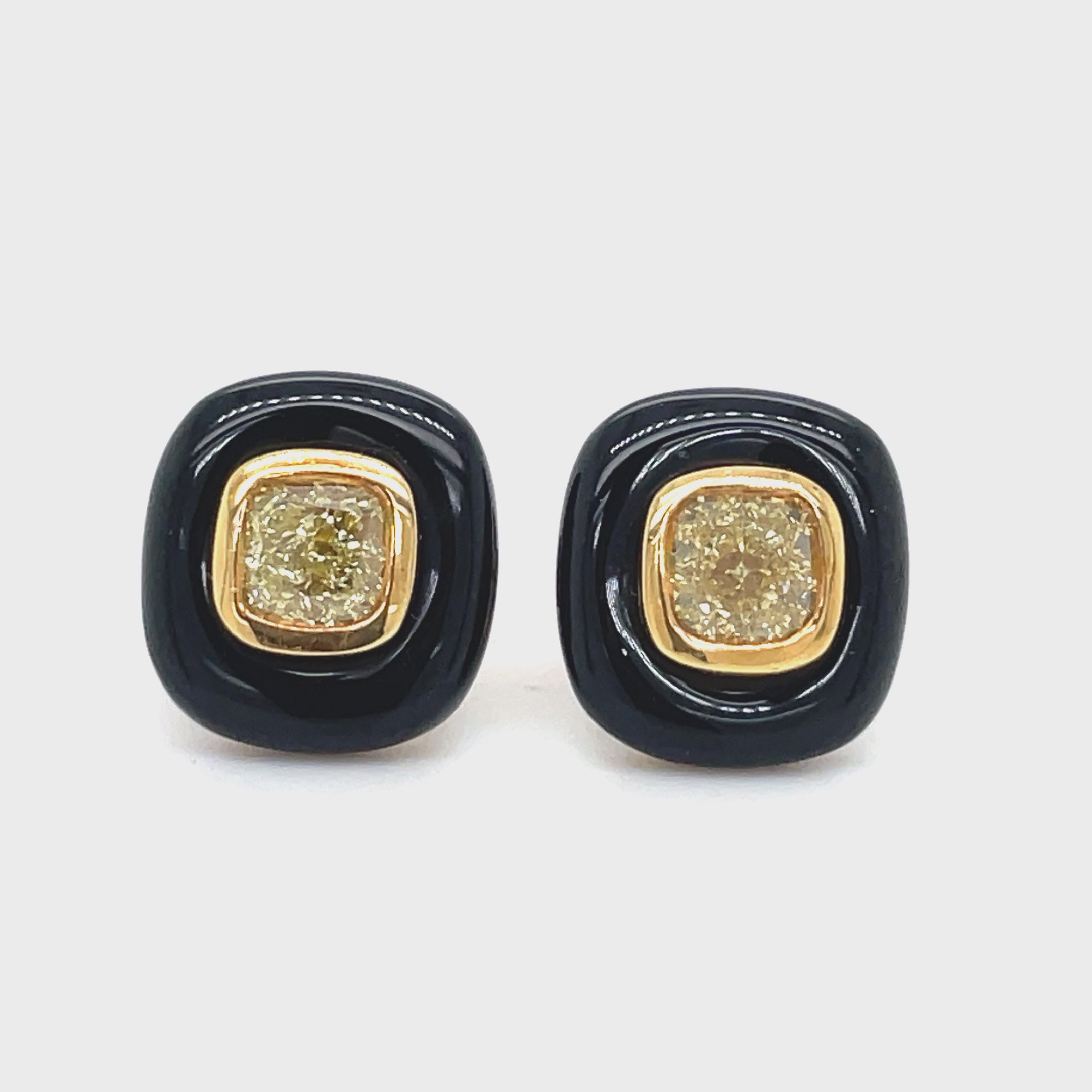 Indulge in luxury with our Fancy Yellow Diamond Stud Earrings, set in 8k yellow gold with a secure friction back. The striking 1.10 cts of fancy yellow diamonds are enhanced by the elegant cabochon onyx, making this a unique and sophisticated addition to your jewelry collection.