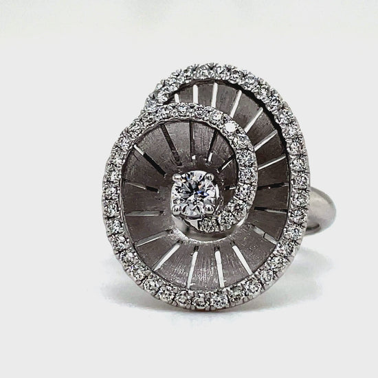 Elevate any look with our Spiral Diamond Ring crafted in 18k white gold. The round diamonds, totaling 0.55 cts, add a touch of brilliance to this luxurious piece. A sophisticated choice for the discerning individual who appreciates the finer things in life.