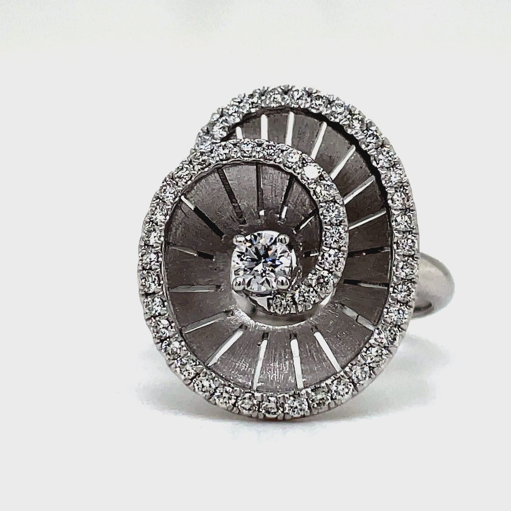Elevate any look with our Spiral Diamond Ring crafted in 18k white gold. The round diamonds, totaling 0.55 cts, add a touch of brilliance to this luxurious piece. A sophisticated choice for the discerning individual who appreciates the finer things in life.