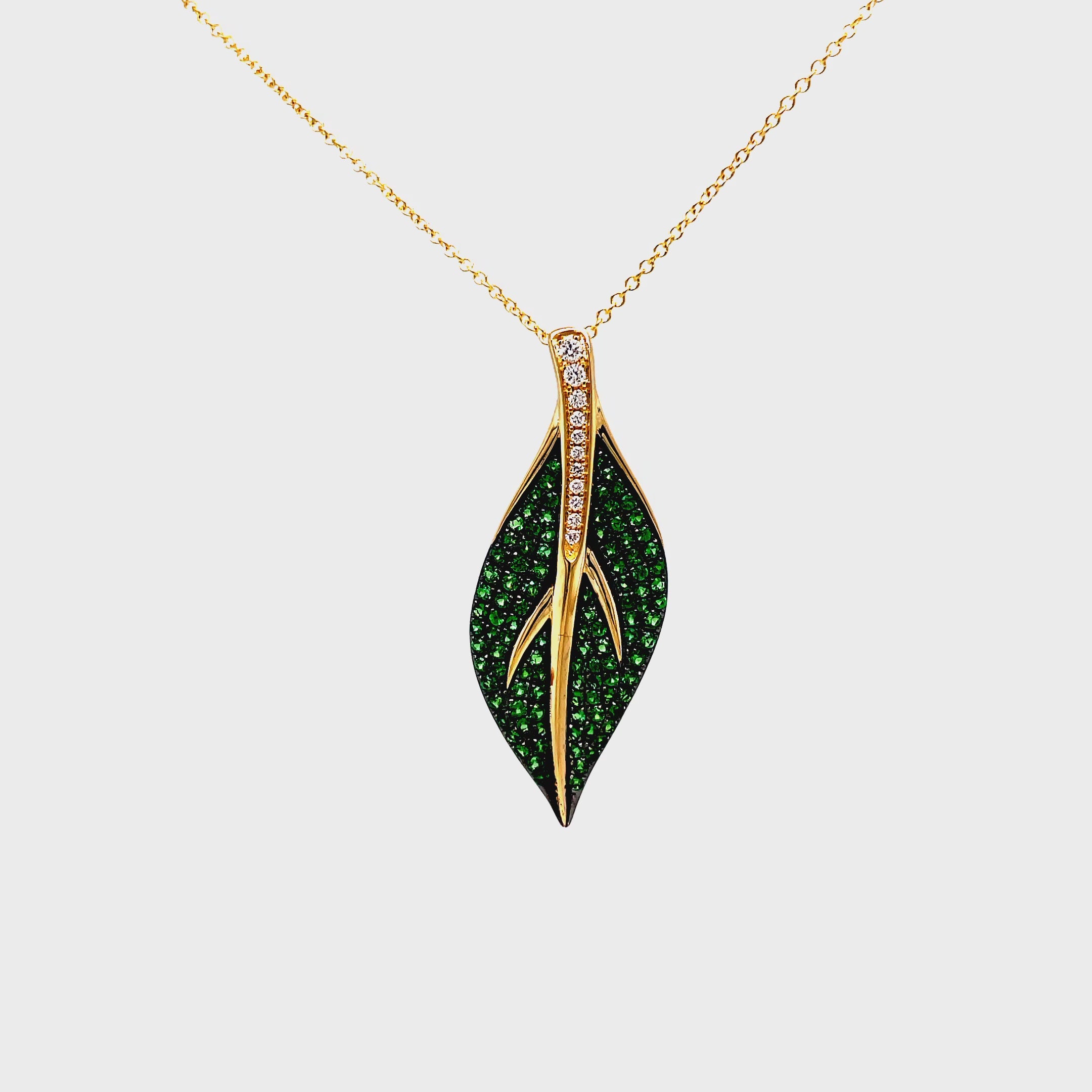 Indulge in luxury with our exquisite Tsavorite and Diamond Leaf Pendant Necklace. Crafted in 14k yellow gold, this necklace features brilliant tsavorite gems and round diamonds in a stunning leaf shape pendant. Elevate any outfit with this elegant and exclusive piece.

18" yellow gold chain optional $399.00