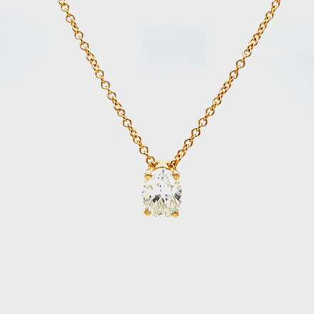 Indulge in understated luxury with our Oval Cut Diamond Solitaire Yellow Gold Necklace. The 1.20 carat oval cut diamond is elegantly set in a secure prong setting, suspended on a 16" yellow gold chain. Perfect for any occasion, this necklace exudes sophistication and grace.