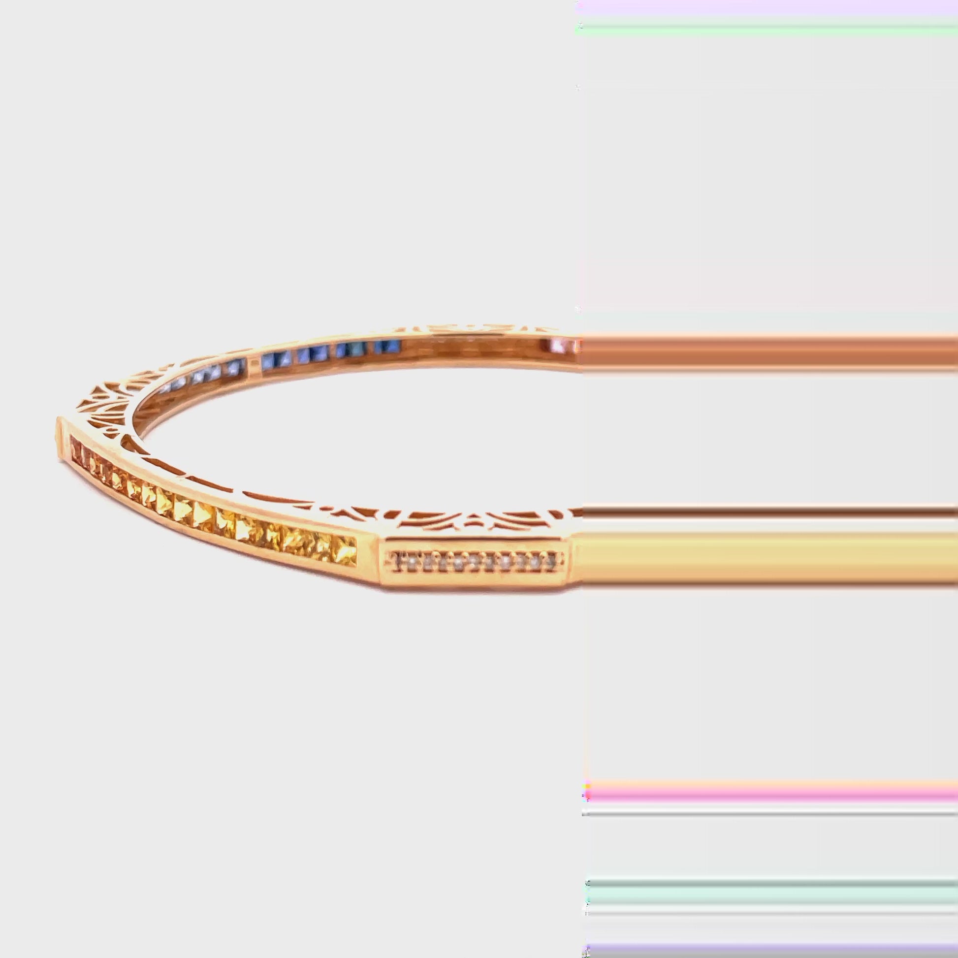 Watch video of side view of Estate Multicolor Sapphire Yellow Gold Bangle