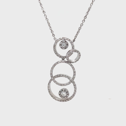 ndulge in the ultimate luxury with our Diamond Circle Pendant Necklace. Four graduated circles, embellished with 1.00 cts of round diamonds, dangle elegantly from a delicate 16" 18k white gold chain. The secure lobster clasp ensures a perfect fit, making this necklace a timeless addition to your collection.