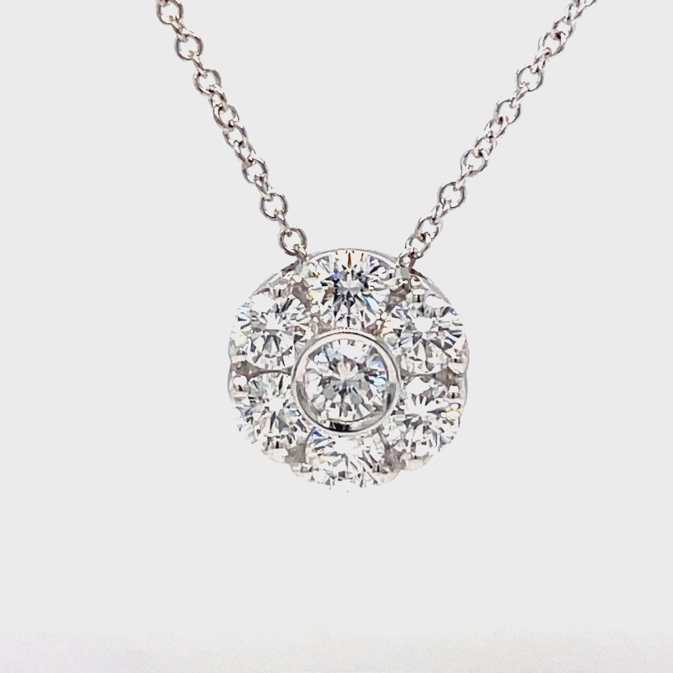 Introducing our exquisite 18k Flower Diamond Pendant Necklace. Crafted with a stunning flower motif pendant, adorned with seven round diamonds totaling 1.60 cts. Made with 18 white gold and paired with an 18' white gold chain, secured with a lobster clasp. Enhance your style with this timeless and elegant piece.