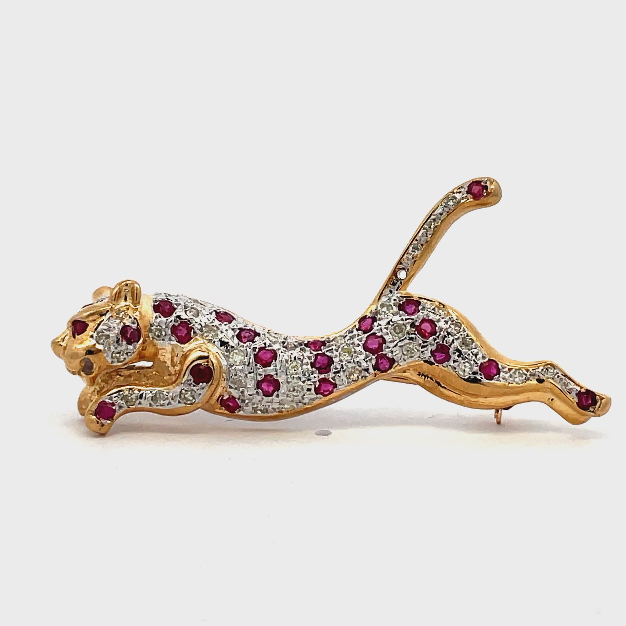 Try on video of Estate Collection 14k Yellow Gold Ruby and Diamond Panther Brooch 