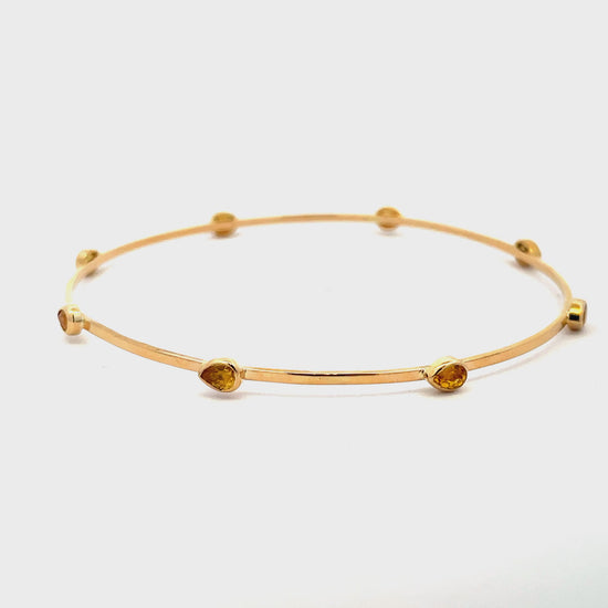 Try on video of 14k Yellow Gold Yellow Sapphire Bangle 
