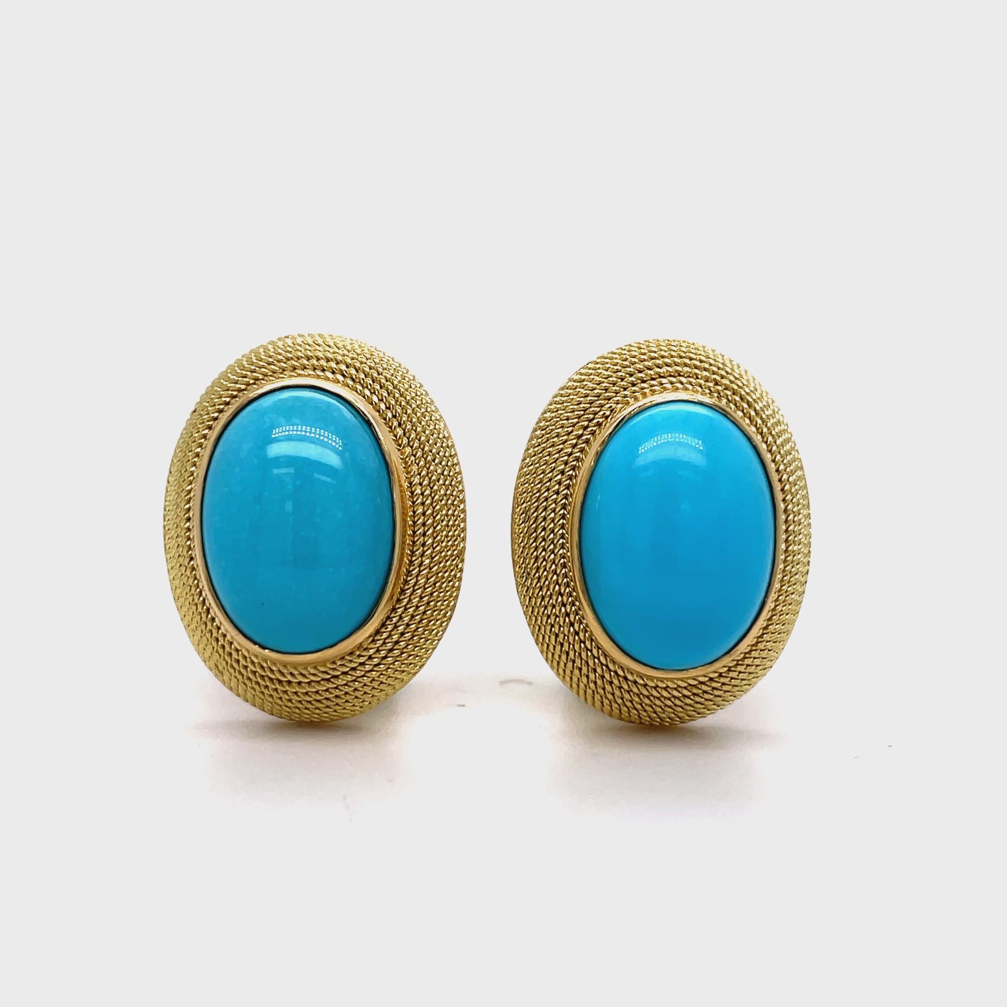 ndulge in luxury with our 18k Italian Made Turquoise Cabochon Earrings. Adorned with stunning 20 x 16.00 mm cabochon turquoise, these earrings are securely fastened with omega clips and flaunt a striking matte finish. Elevate your style with these sophisticated and exclusive earrings.