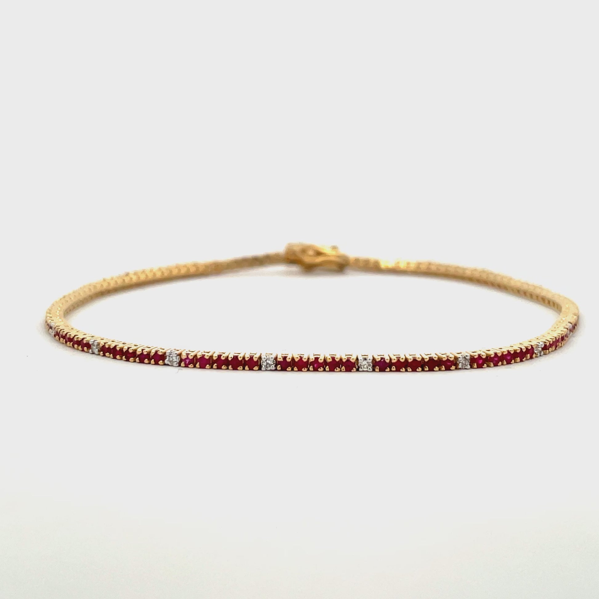Try on video of 14k Yellow Gold Ruby & Diamond Line Bracelet 