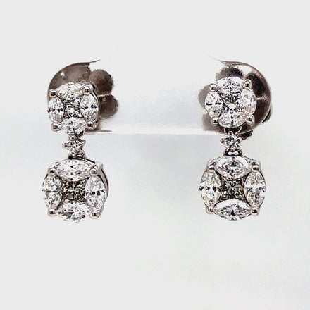 Make a statement with our Diamond Round Double Drop Illusion Setting Earrings. These 18k white gold earrings feature a design that creates the illusion of a large round cut diamond. With a total of 1.43 cts of round and marquise cut diamonds, these earrings are sure to catch everyone's eye. The large earrings back provides comfort and security. Perfect for any special occasion.