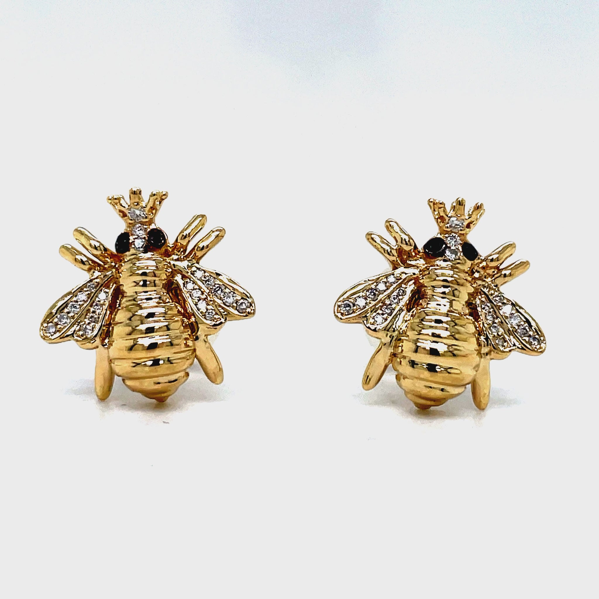 Indulge in exquisite luxury with our 14k Yellow Gold Diamond Queen Bee Earrings. Crafted from premium 14k gold, these bee stud earrings feature a charming 14.00 mm size adorned with sparkling 0.12 ct round diamonds. Effortlessly secure them with smooth friction backs for a truly elegant and exclusive look.