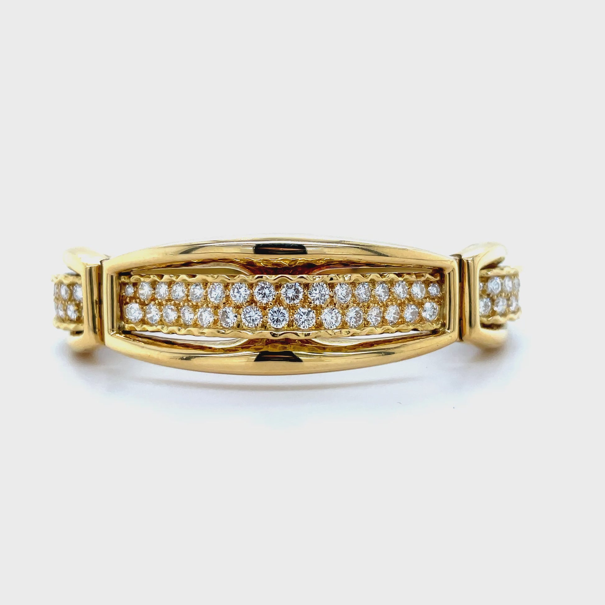 ndulge in luxury with our Graduated Diamond Bangle in 18K Yellow Gold. Adorned with 3.00 carats of sparkling round diamonds, this three tier style bangle exudes elegance and sophistication. With a hinged system, this bangle is not only stunning but also comfortable to wear, making it the perfect accessory for any occasion.