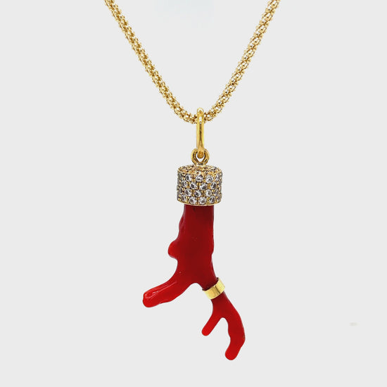 Indulge in pure luxury with our Red Coral Branch Diamond Cap Necklace. Adorned with a striking red coral branch and accented by round diamonds totaling 0.50 carats, this 30" necklace is a true statement piece. Crafted with 18k yellow gold, it exudes sophistication and exclusivity. Elevate your style with this elegant and timeless necklace. Handmade in our store