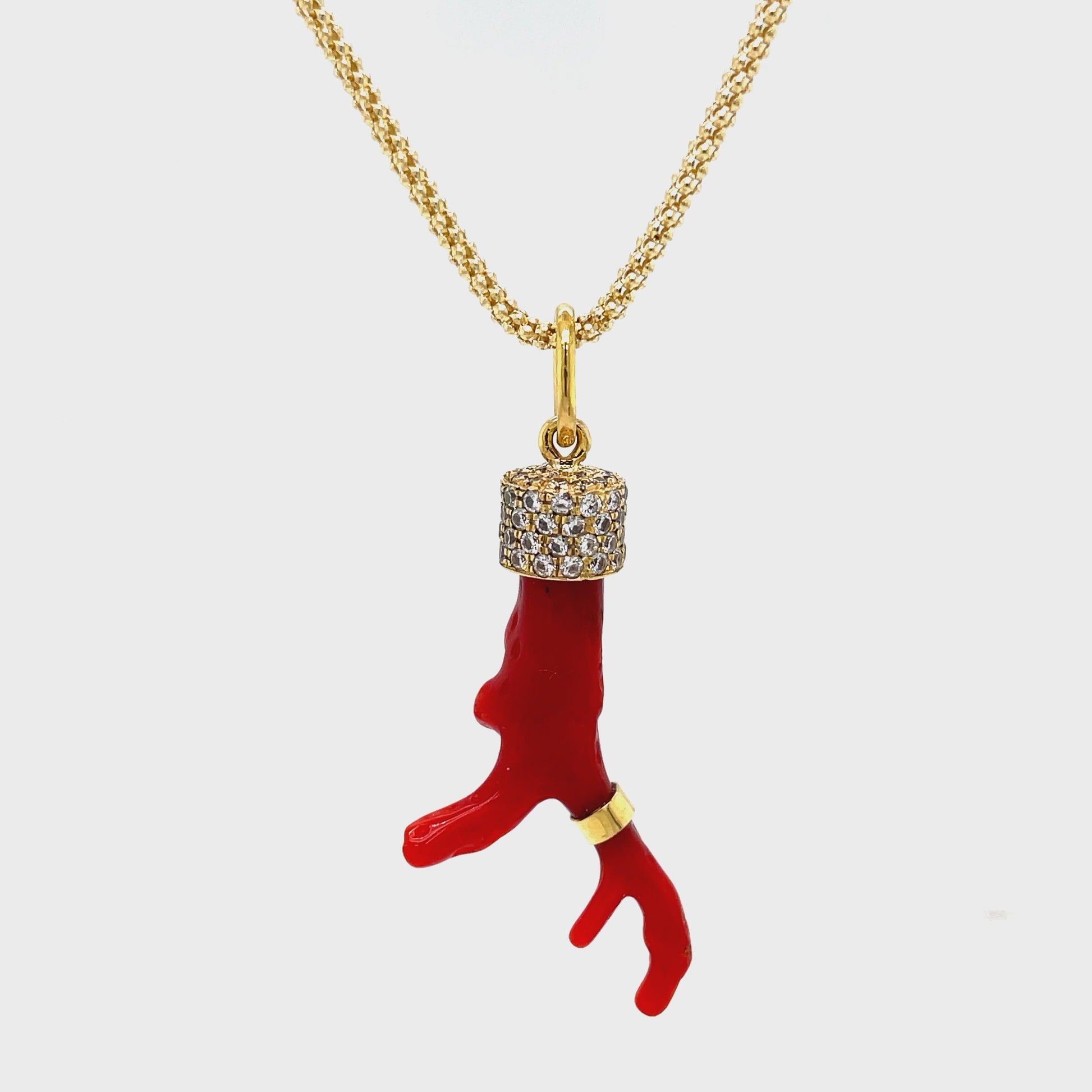 Indulge in pure luxury with our Red Coral Branch Diamond Cap Necklace. Adorned with a striking red coral branch and accented by round diamonds totaling 0.50 carats, this 30" necklace is a true statement piece. Crafted with 18k yellow gold, it exudes sophistication and exclusivity. Elevate your style with this elegant and timeless necklace. Handmade in our store